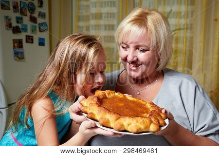 Kirov, Russia - November 04, 2018: Adalt Mother And Her Young Daughter In A Kitchen