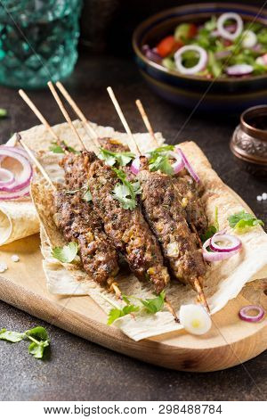 Lula Kebab From Minced Meat (beef, Lamb, Veal) On Pita Bread (lavash), Shish Kebab. With Red Onion,