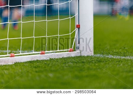 Soccer Football Goal With Net. Football Pitch Field With Fresh Green Grass. Soccer Low Angle Soccer 