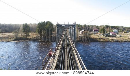 Aerial View On The Rail Bridge Across The River In Rural Place In Spring