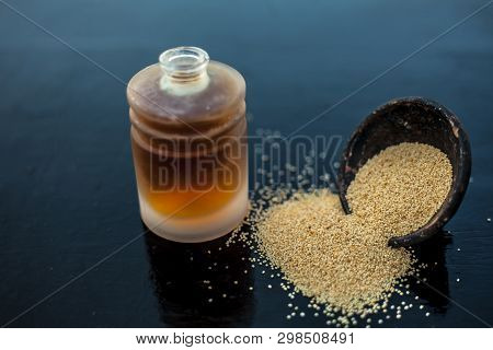 Close Up Of Clay Bowl On Wooden Surface Full Of Poppy Seeds Or Khus Or Opium Poppy Or Breadseed Popp