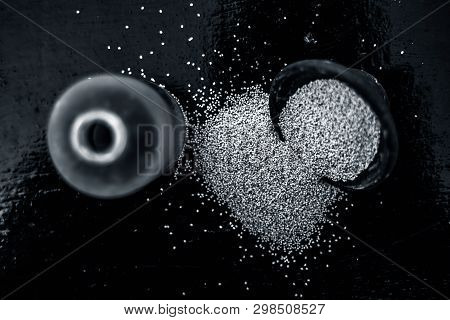 Close Up Of Clay Bowl On Wooden Surface Full Of Poppy Seeds Or Khus Or Opium Poppy Or Breadseed Popp