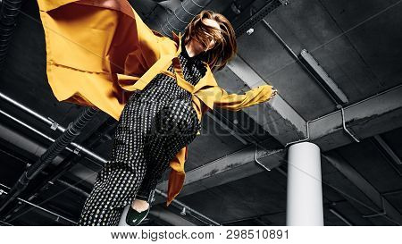 Young Woman In Underground Parking