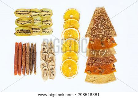 Various Fruit Chips And Pastila On White Background. Assorted Dehydrated Apple, Banana, Kiwi, Orange