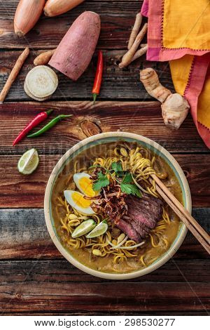 Malaysia Spicy Noodle Mee Rebus With Beef Egg And Fried Onion, Copy Space