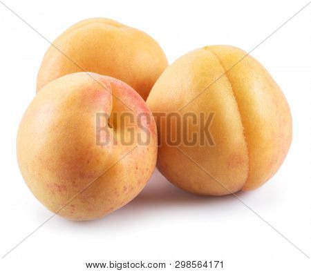 Ripe apricots with leaves isolated on the white background.