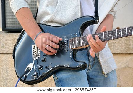 Young Man Playing Electric Guitar. Guitar And Hands. Music Concept