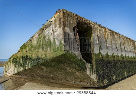The Remains Of The Mulberry Harbour At Arromanches, Normandy France