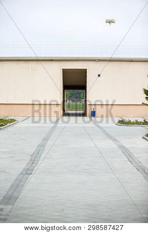 Entrance To The Football Stadium Through The Tunnel. Fence Around.