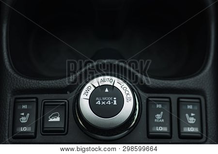 Button Switches Control For Car With Soft-focus And Over Light In The Background. 2wd Auto Lock Butt