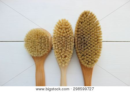 Close-up Of Wooden Massage Brush Isolated On White Background. Brush For Dry Massage. Anti-cellulite