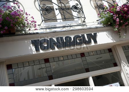 A Toni & Guy Hairdressers Sign On The High Street In The Town Of St Pierre Port (st Peter Port), The