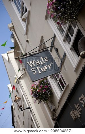 A White Stuff Shop Sign On The High Street In The Town Of St Pierre Port (st Peter Port), The Main S