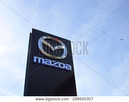 Ljubljana, Slovenia - March 22 2019: Brand Logo At The Entrance To Mazda Dealership. Mazda Is A Japa