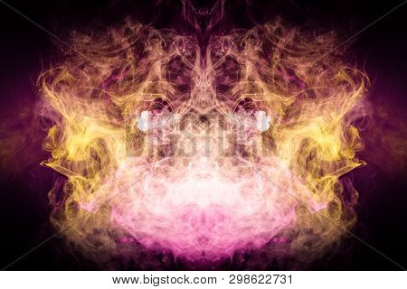 Thick Colorful Smoke Of  Pink And Yellow In The Form Of A Skull, Monster, Dragon On A Black Isolated