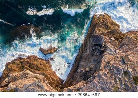 The Rocky Coastline Of East Sydney Where The Cliffs Have Broken Off In Large Chunks And Waves Contin