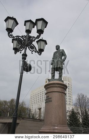 Moscow, Russia - April, 2019. Monument To Stolypin On The Background Of The Government House