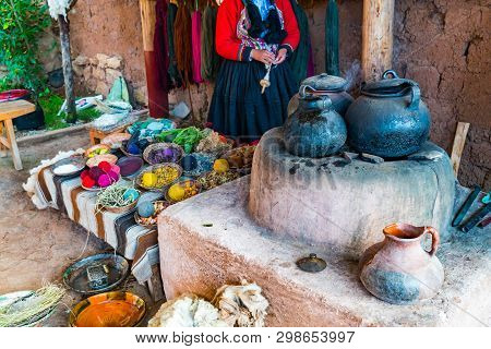 Inca Woman And The Simple Equipment For Natural Dyeing Wool Process At Cusco In Peru