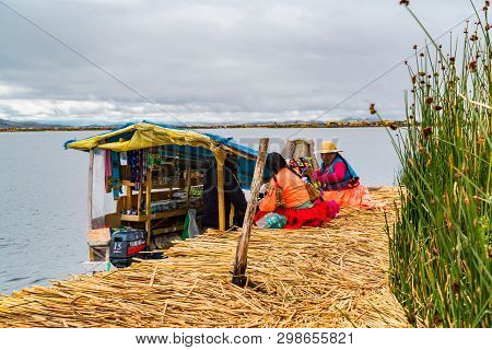 Puno, Peru - February 1, 2016 : Uru Woman Wearing Traditional Cloths Buying Food And Necessary Thing