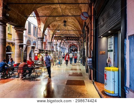 Waiter Serving Under The Archway Of Portico Della Morte In Via De Musei In Bologna, Italy, 27 Apr 20