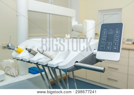 Dental Office. Dentist Chair. A Set Of Dental Instruments.