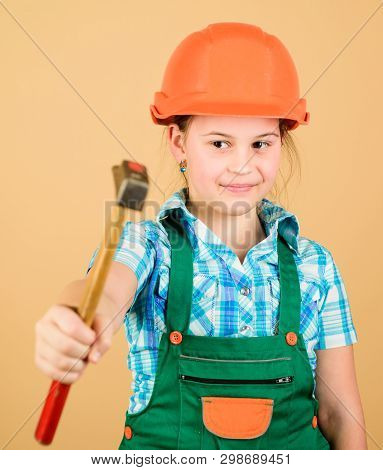 Labor Day. 1 May. Repair Shop. Hammer In Hand Of Small Girl Repairing In Workshop. Foreman Inspector
