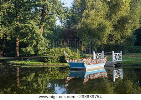 Frederiksberg, Denmark - September 8, 2016: A Wooden Boat And A Jetty In Frederiksberg Gardens.