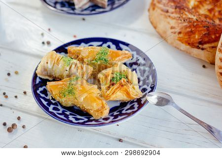 Asian Dessert Baklava Or Pahlava On A Traditional Oriental Plate, Great Image For Your Needs.