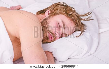 How Much Sleep You Actually Need. Man Handsome Guy Lay In Bed. Get Adequate And Consistent Amount Of