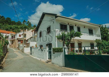 Facade Of Cute House With Whitewashed Wall And Green Courtyard, In An Alley In Slope At Unhais Da Se