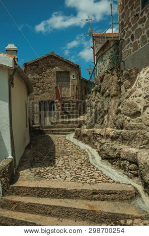 Narrow Cobblestone Alley And Old Houses With Stone Wall, In A Sunny Day At Alvoco Da Serra. A Cute V