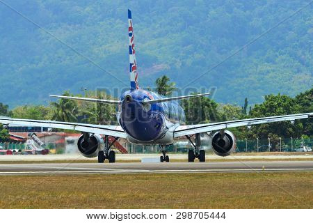 Airplane Taxiing On Runway