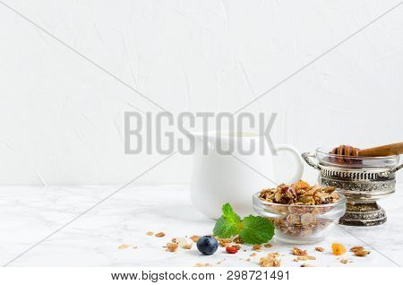 Delicious Homemade Granola In Glass Jar, Agave Nectar, Plant Milk And Fresh Blueberries. Healthy Pla