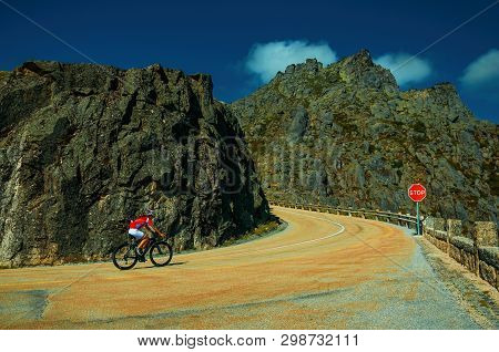 Serra Da Estrela, Portugal - July 14, 2018. Curve On Roadway Passing Through Rocky Landscape With Cy