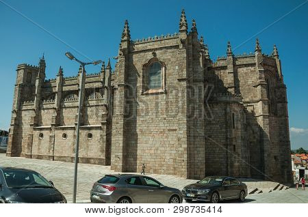 Guarda, Portugal - July 16, 2018. Small Square With Cars In A Sunny Day In Front The Gothic Cathedra