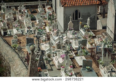 Gouveia, Portugal - July 17, 2018. Cemetery With Crypts And Marble Tombs Decorated By Flowers At Gou