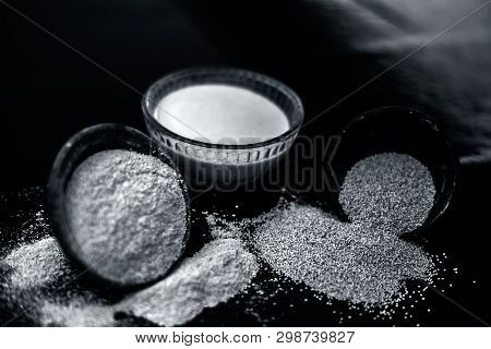 Clay Bowl On Wooden Surface Full Of Poppy Seeds Or Khus Or Opium Poppy Or Bread Seed Poppy With Its 