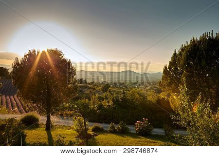 French Town Of Barjac, Hilly Mediterranean Landscape At Sunset, South France, Europe
