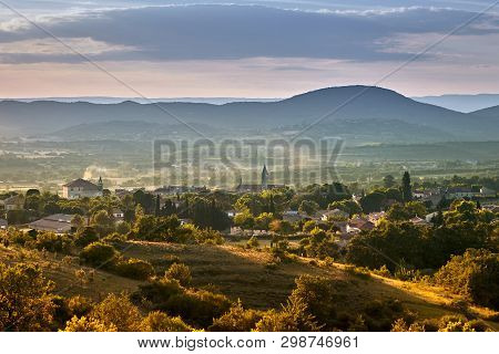 French Town Of Barjac, Hilly Mediterranean Landscape At Sunset, South France, Europe