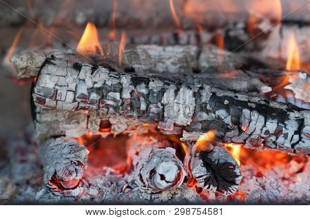 Burning Firewood In The Fireplace Close Up, Bbq Fire. Charcoal Fire With Sparks.