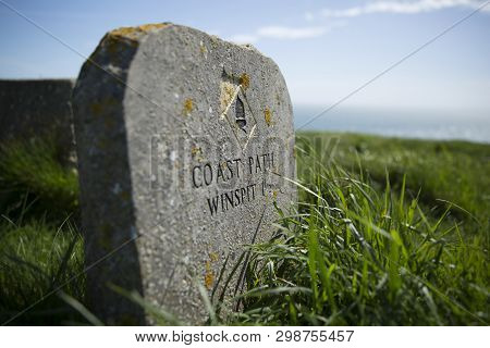 South West Coast Path Marker At Saint Aldheims Head Near The Square Chapel, St Alheims Head, Dorset,