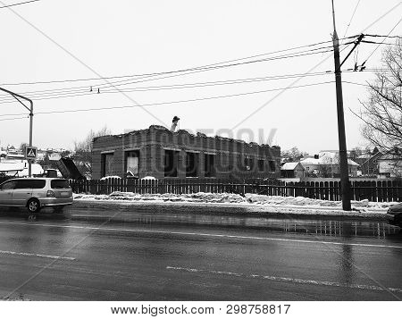 Repair And Construction - Brick House Under Construction And A Crane Nearby