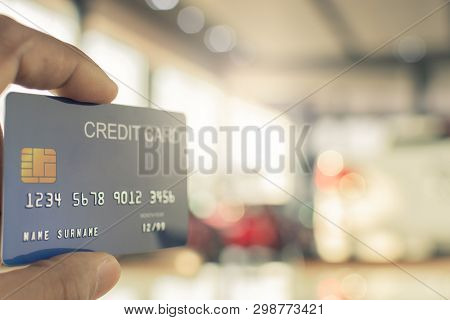Man Holding Credit Card For Blurred Bokeh Background E-shopping Marketing Digital, Consumer Purchase