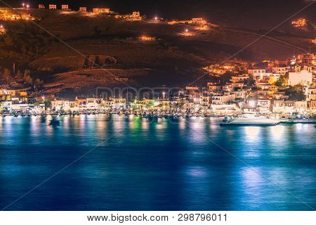 Night View Of Gavrio Port At Andros Island In Greece.