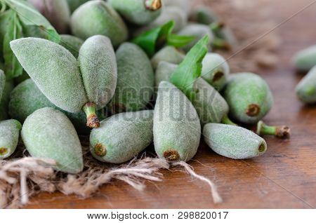 Stack Of Fresh Green Almond Nut Fruits On Table İn The Kitchen.