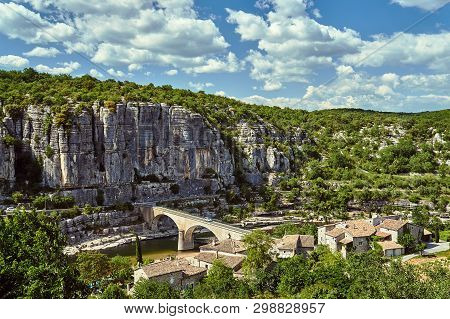 Stone Bridge Over The River Ardeche In The Village Of Balazuc In France