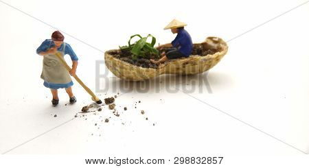 Conceptual Illustration, Keep Struggle, Mini Figure Man Farming At Limited Area, Peanut Skin, With W