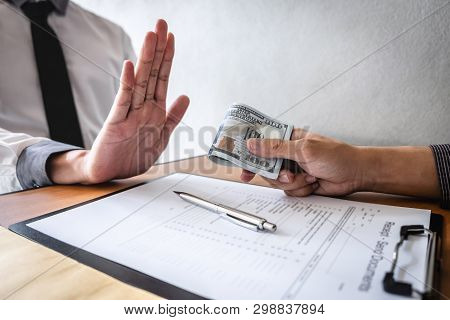 Anti Bribery And Corruption Concept, Business Man Refusing And Don't Receive Money Banknote In Envel