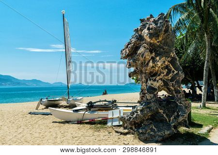 Sailboat And Stone On Beach With Palms In Vietnam In Summer Travel