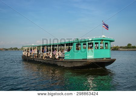 Bang Krachao,thailand. April 27, 2019 :  Passengers In A Green Ferry Boat With Thai Flag, Transport 